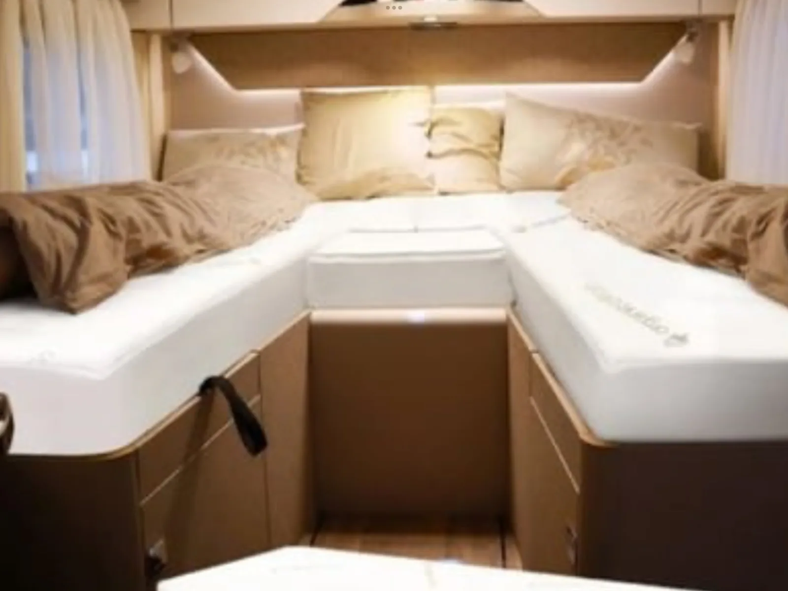 Boat mattress layout inside a yacht cabin