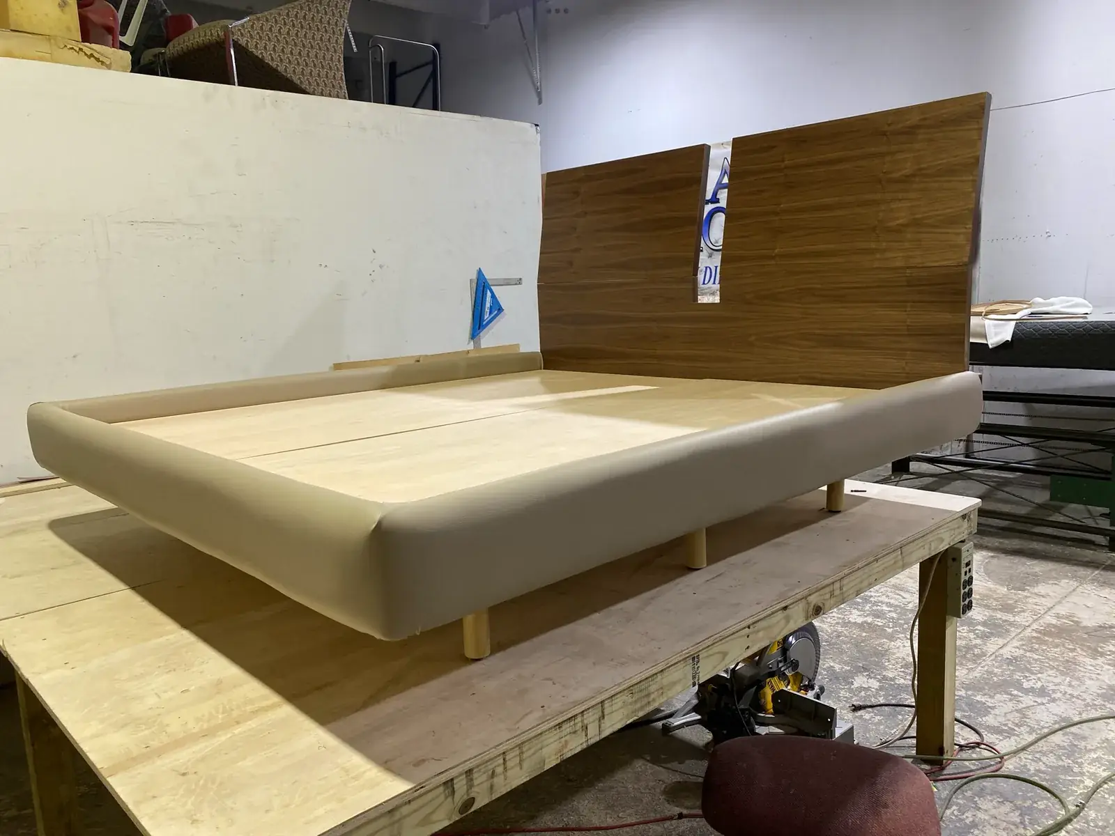 Custom bed base and headboard built by the Maylin carpentry team