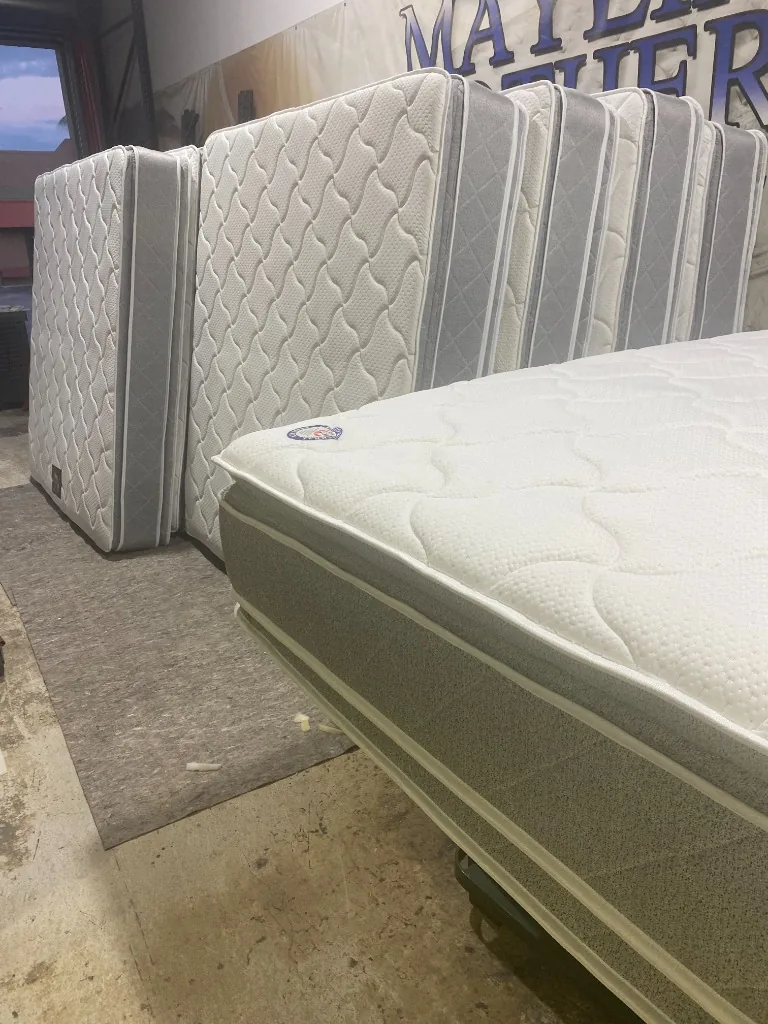 Stack of Dual-sided pillow top mattresses