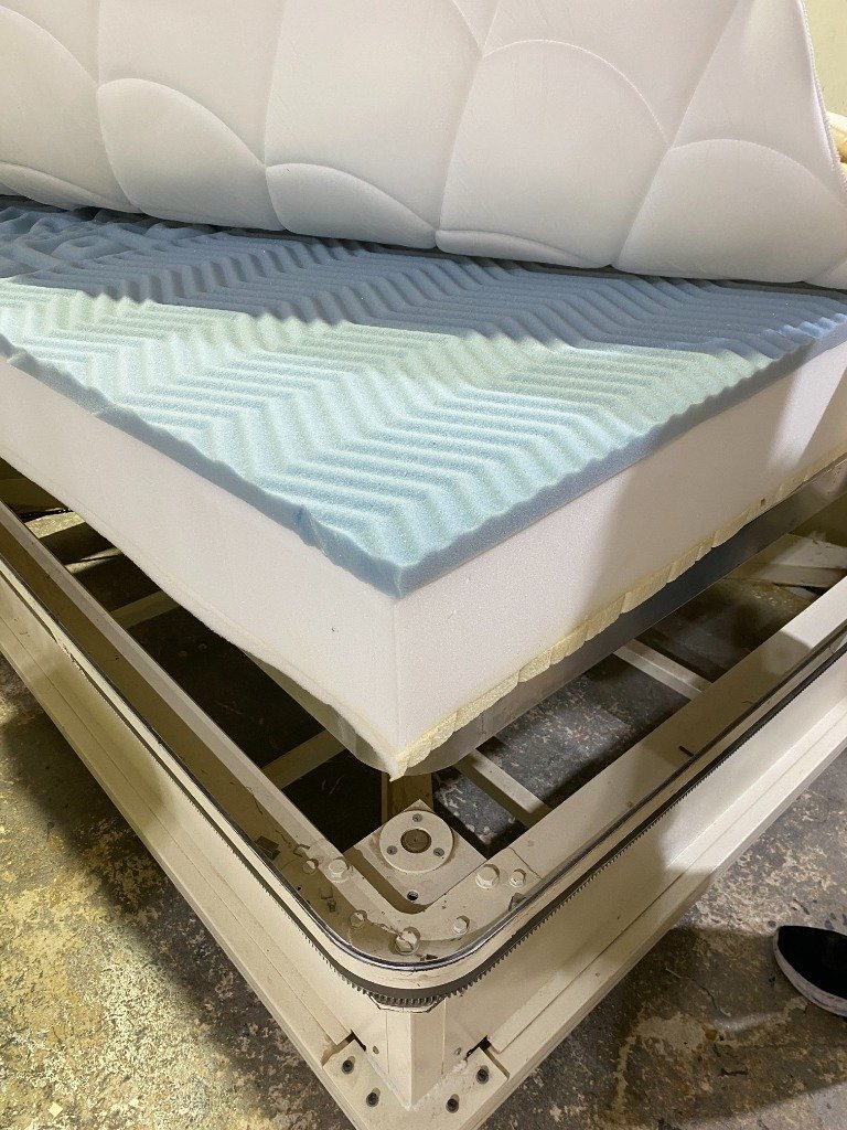 Adding the quilted top layer to the high density foam
